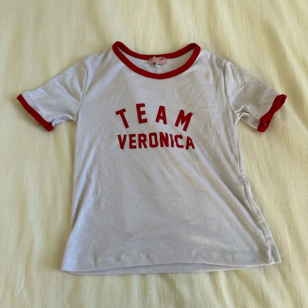 White graphic tee with red lining around arms and neck from Archie Comics